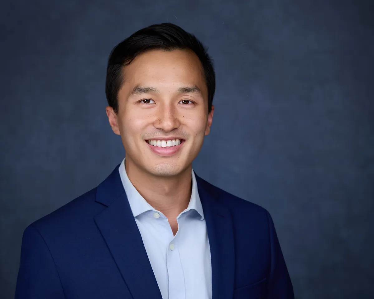 Professional headshot with blue background - Philadelphia photographer